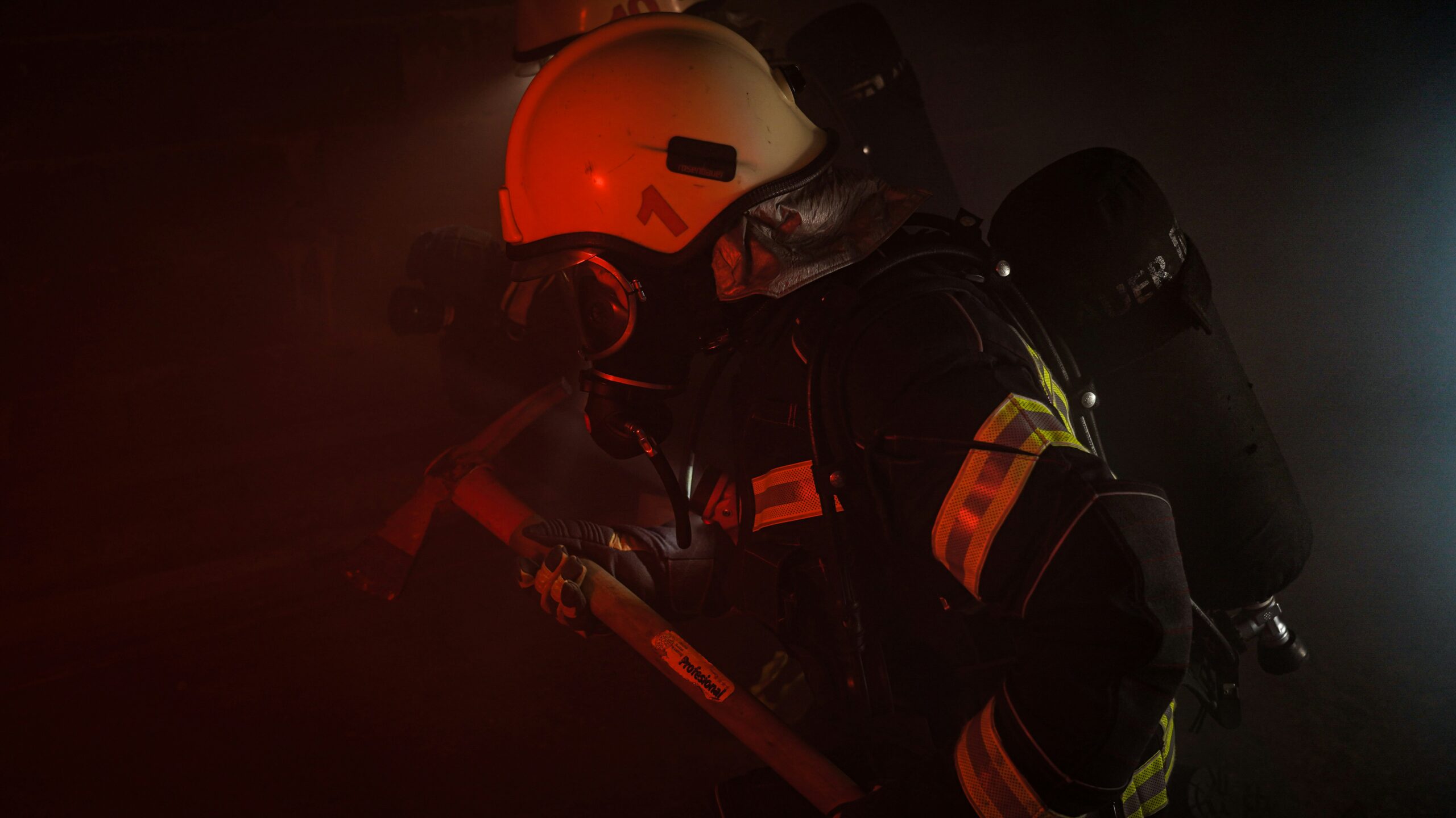 man in orange helmet and black helmet